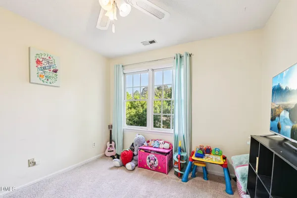 a bedroom with furniture and a window