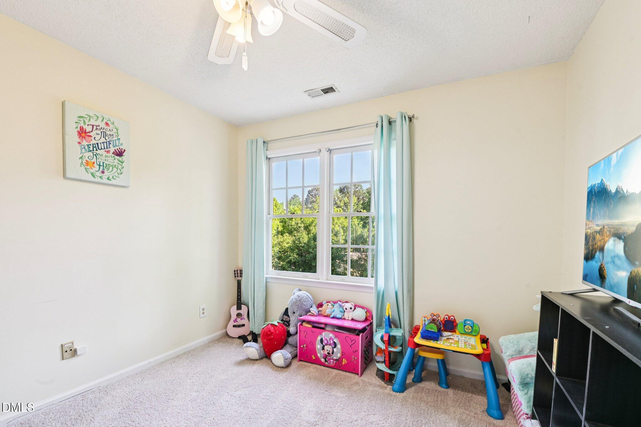4508 Emmit Drive Raleigh, NC 27604 - Photo 23 of 42 a bedroom with furniture and a window