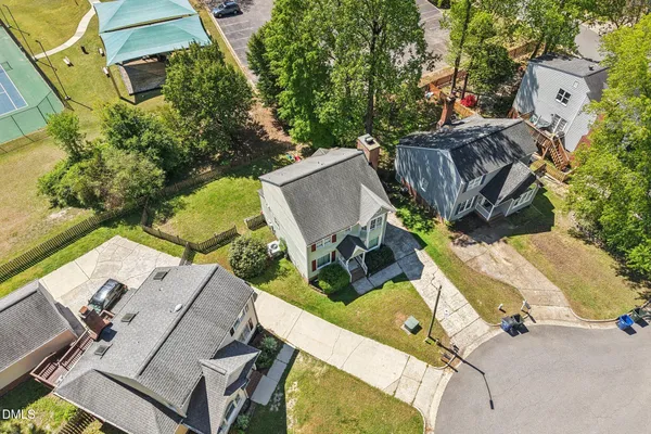 an aerial view of a house with outdoor space