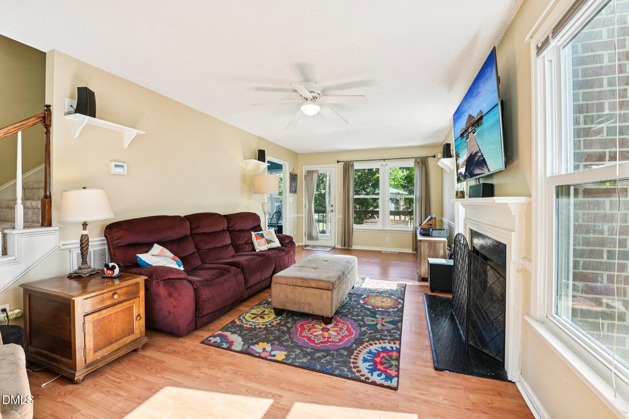 4508 Emmit Drive Raleigh, NC 27604 - Photo 7 of 42 a living room with furniture and a fireplace