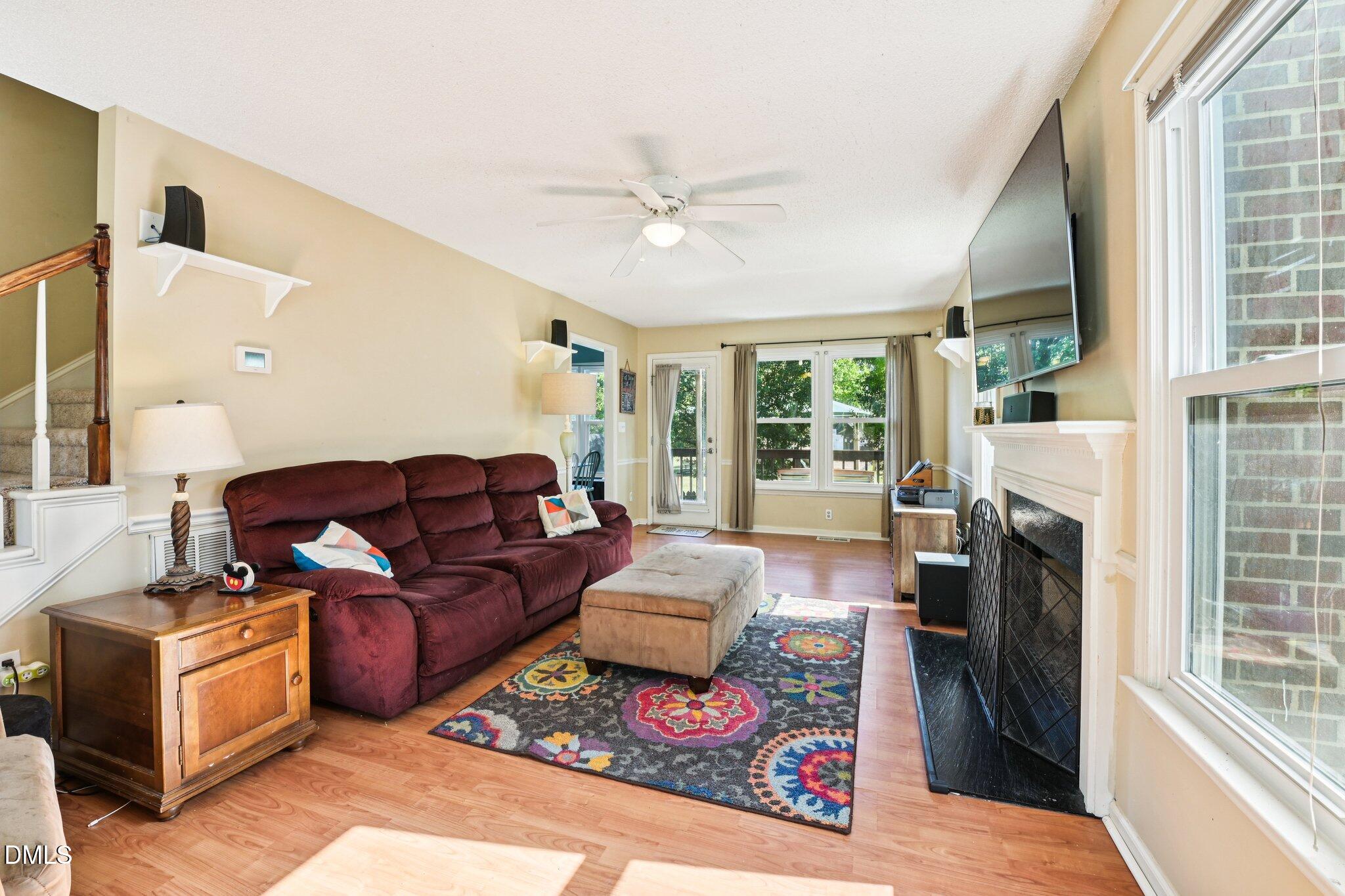4508 Emmit Drive Raleigh, NC 27604 - Photo 8 of 42 a living room with furniture and a fireplace