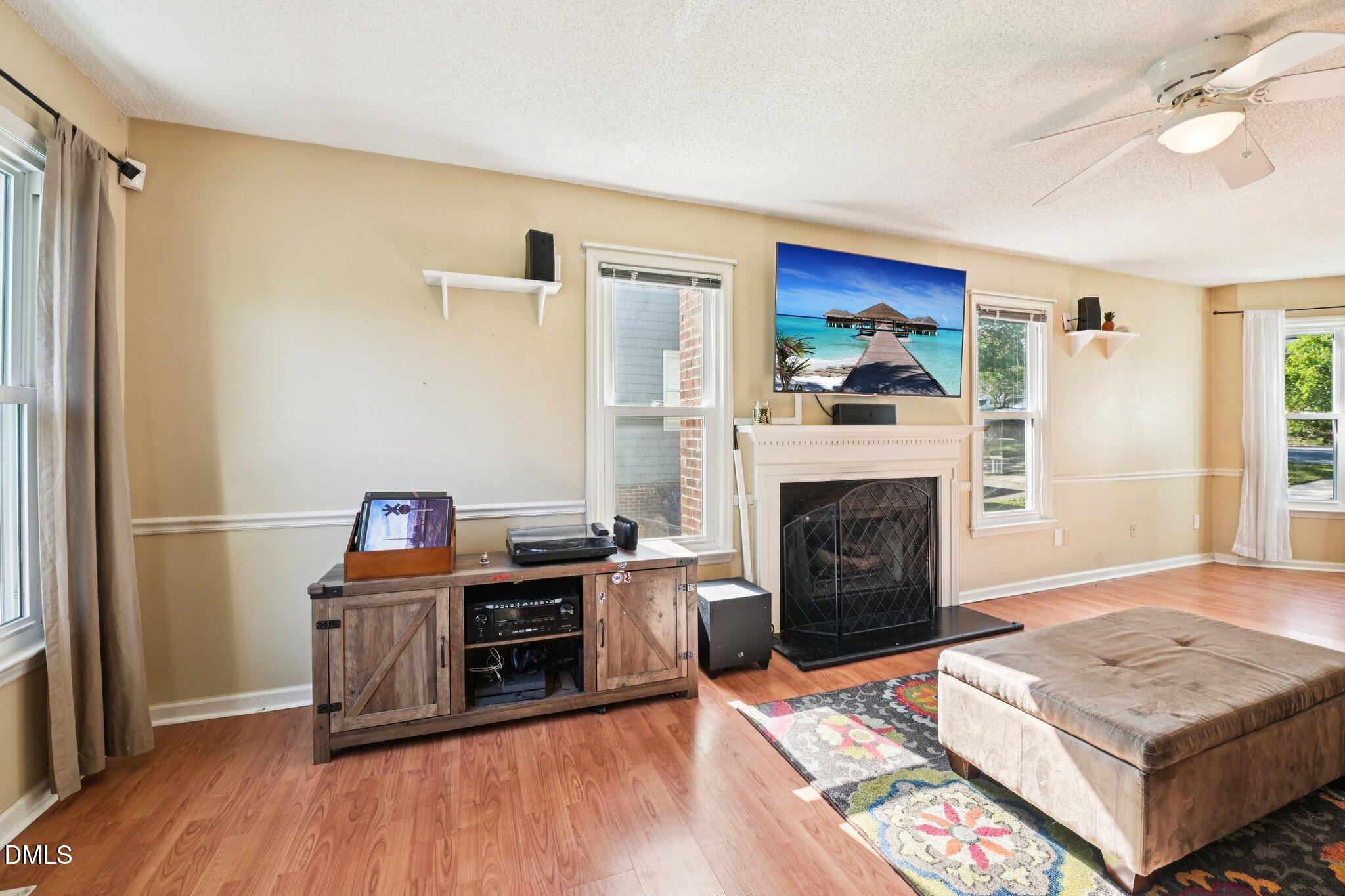 4508 Emmit Drive Raleigh, NC 27604 - Photo 10 of 42 a living room with furniture and a fireplace