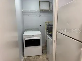 a utility room with washer and dryer