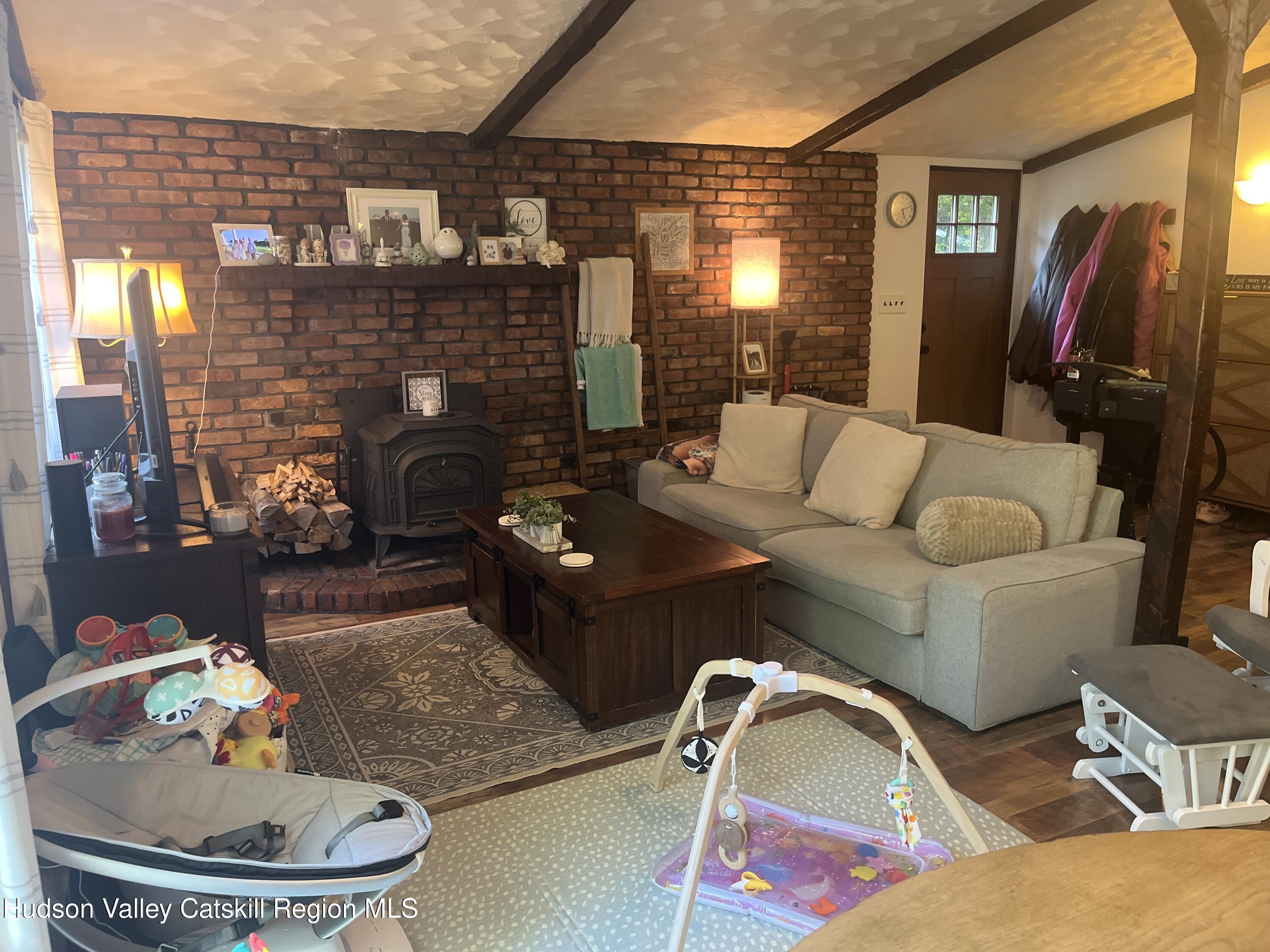 5538 Cauterskill Road Catskill, NY 12414 - Photo 18 of 23 a living room with furniture and a fireplace
