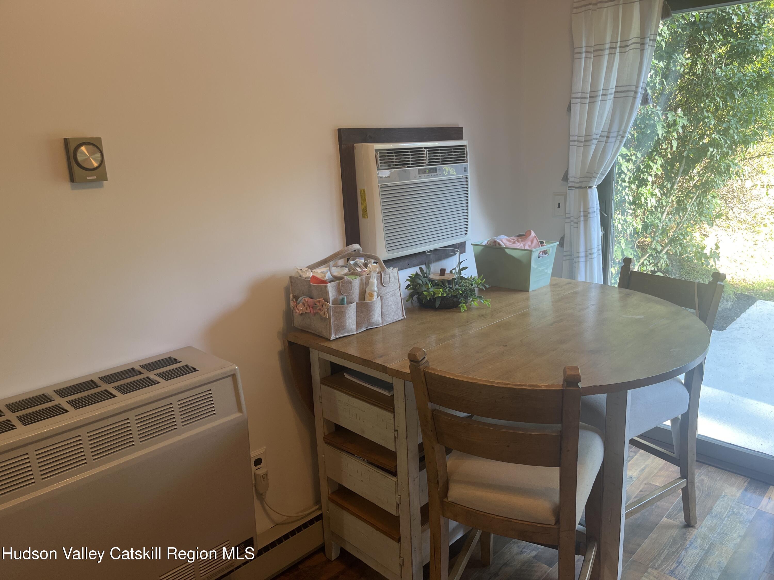 5538 Cauterskill Road Catskill, NY 12414 - Photo 23 of 23 a view of a dining room with furniture and wooden floor