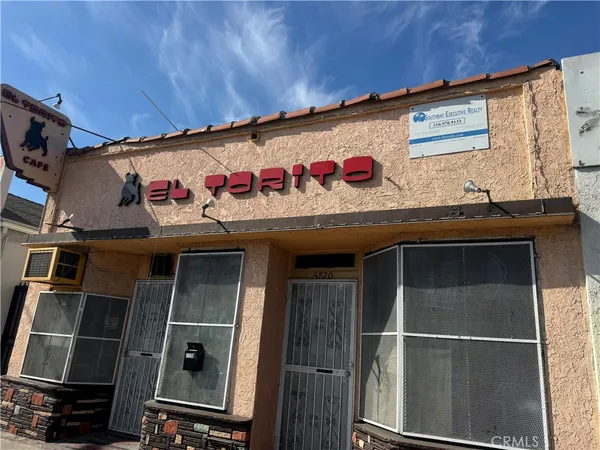 a front view of a building with retail shop