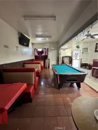 a bedroom with furniture and a flat screen tv