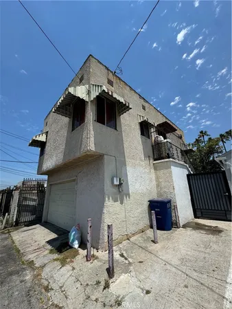 a front view of a house with parking