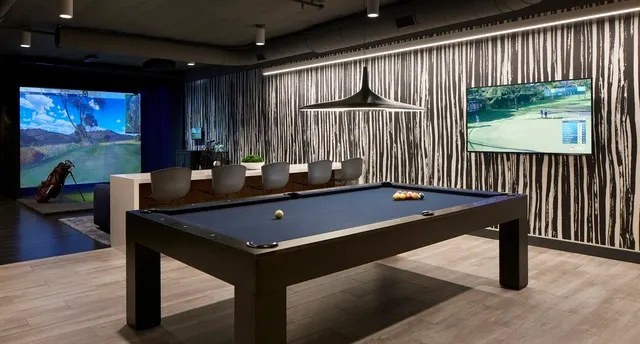 a living room with lots of furniture and a table