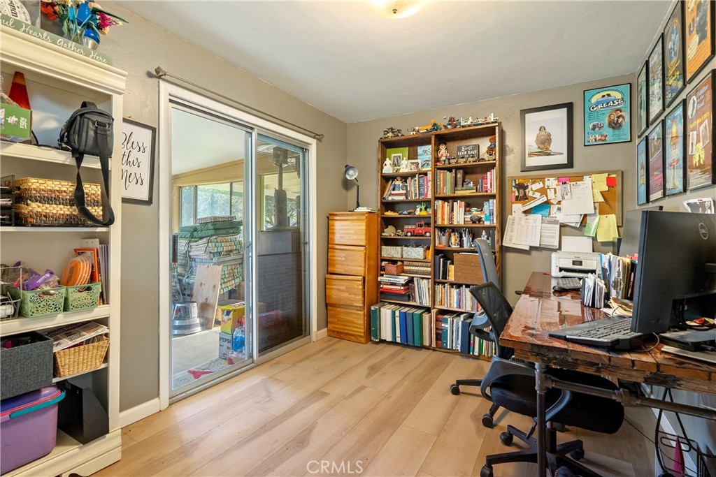 8892 Palomar Avenue Atascadero, CA 93422 - Photo 18 of 49 Sliding doors provide access to the covered patio and backyard, with laminate flooring throughout.