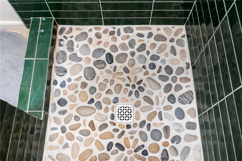 8892 Palomar Avenue Atascadero, CA 93422 - Photo 24 of 49 Shower showcases a custom tile floor, adding unique style and texture.