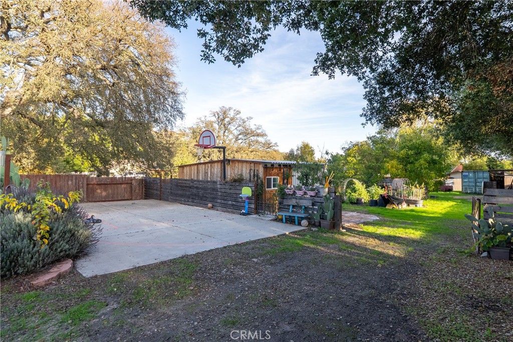 8892 Palomar Avenue Atascadero, CA 93422 - Photo 33 of 49 The backyard offers endless possibilities for relaxation, play, and entertaining, including a full basketball court.