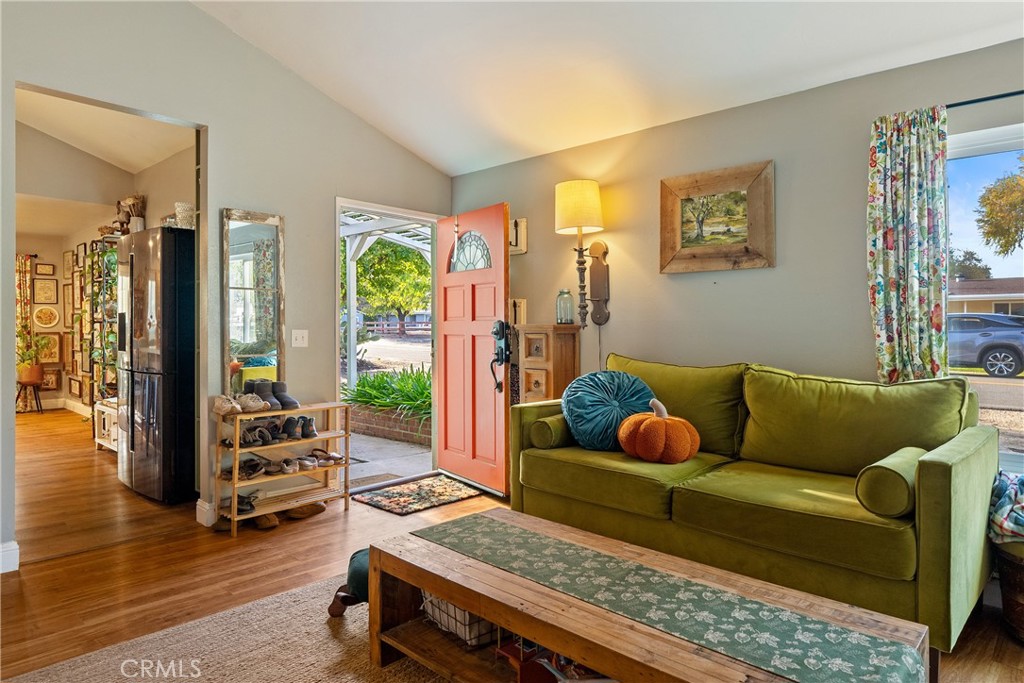 8892 Palomar Avenue Atascadero, CA 93422 - Photo 7 of 49 Walk in and relax. Laminate flooring flows throughout the main living areas, complemented by vaulted ceilings that create a bright, spacious feel.