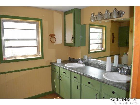 147 J R Sayles Road Canton, NC 28716 - Photo 14 of 23 a bathroom with a sink and a mirror