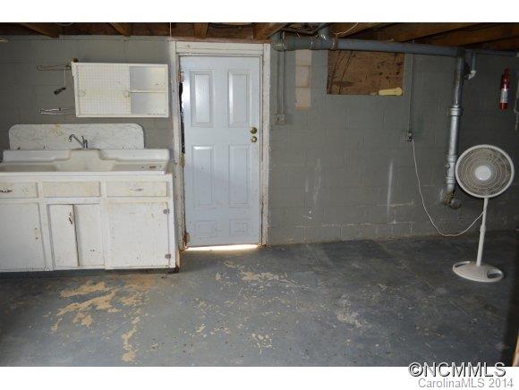 147 J R Sayles Road Canton, NC 28716 - Photo 22 of 23 a bathroom with a sink and a mirror