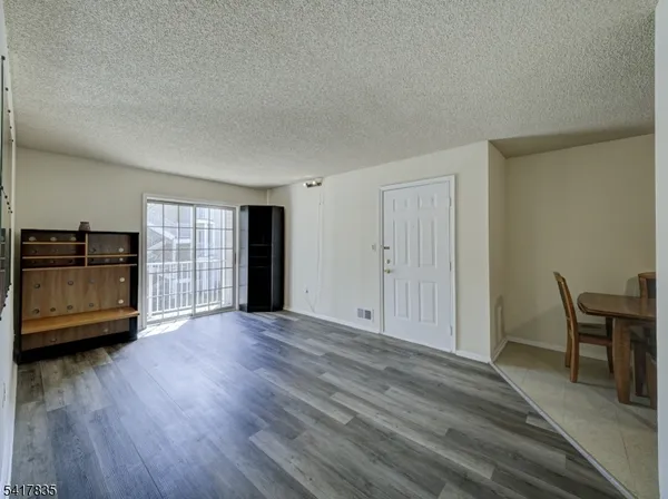 a view of a livingroom with furniture and wooden floor