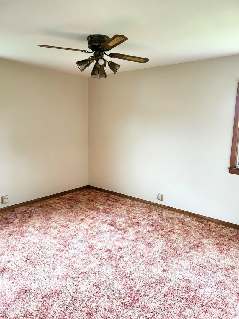 5890 Highway 2 Oregon, IL 61061 - Photo 16 of 18 a view of a room with a ceiling fan