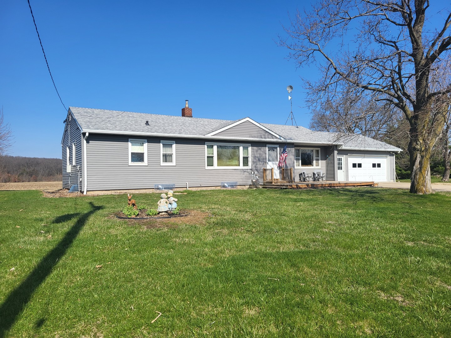 5890 Highway 2 Oregon, IL 61061 - Photo 2 of 18 a front view of a house with a garden