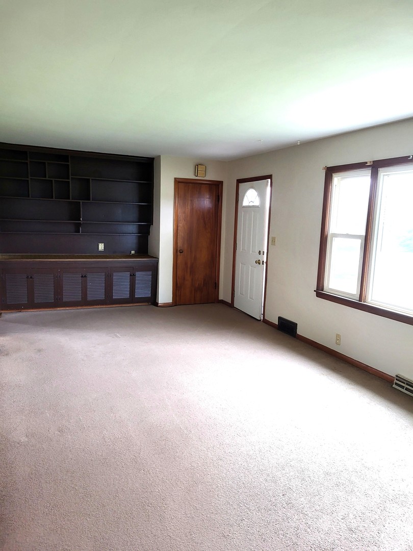 5890 Highway 2 Oregon, IL 61061 - Photo 4 of 18 an empty room with windows
