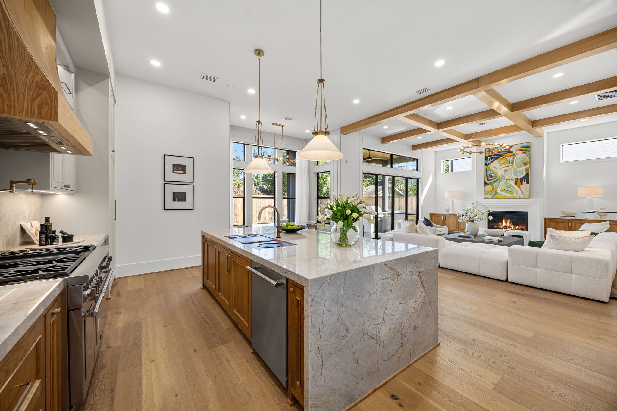 1032 West 41st Street Houston, TX 77018 - Photo 12 of 46 Butler's Pantry features Taj Mahal counters/backsplash, glass-front windows, beverage fridge, wet bar sink w/ glass washer & a walk-in pantry opposite the counter.