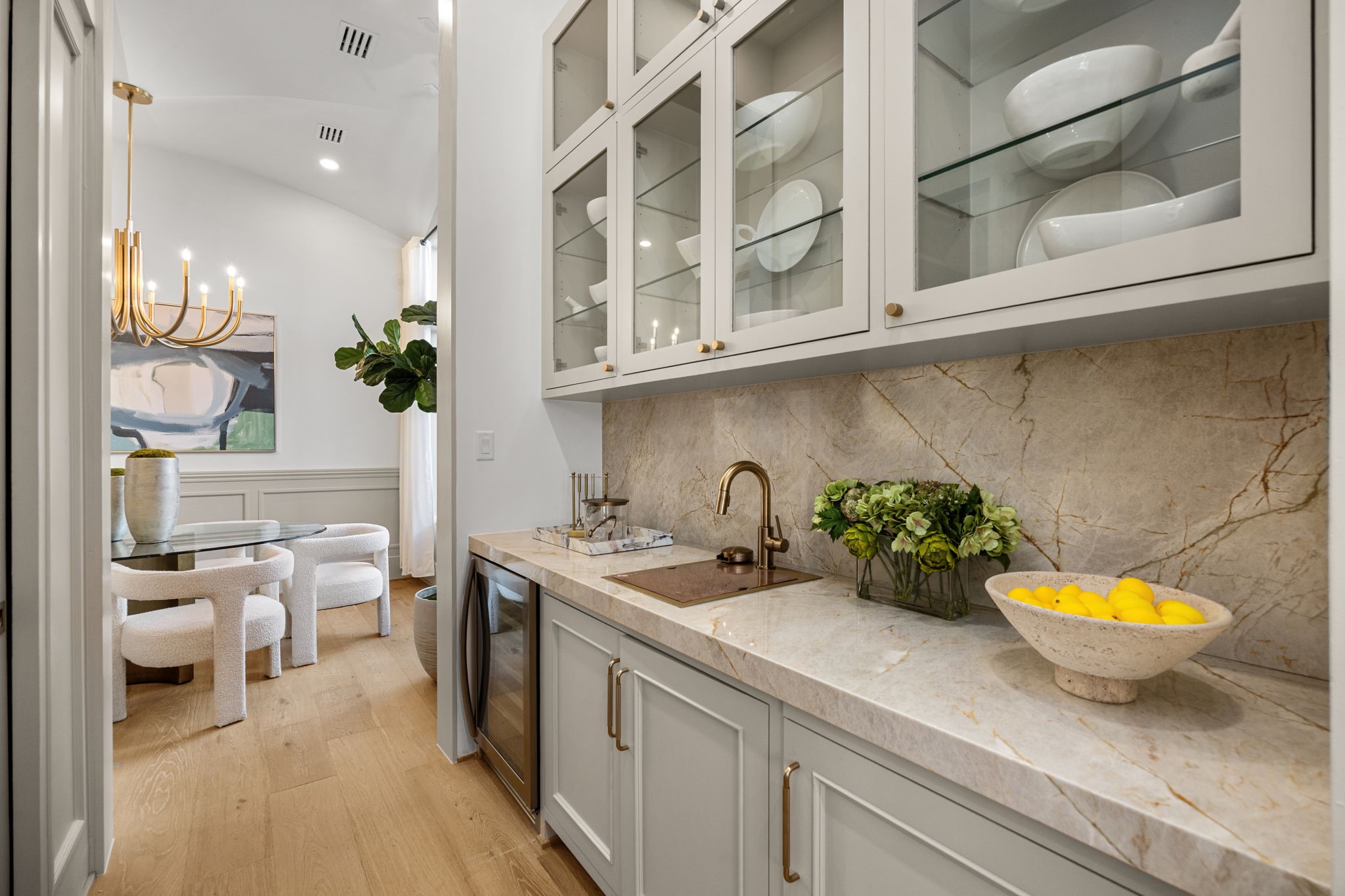 1032 West 41st Street Houston, TX 77018 - Photo 13 of 46 Butler's Pantry features Taj Mahal counters/backsplash, glass-front windows, beverage fridge, wet bar sink w/ glass washer & a walk-in pantry opposite the counter.