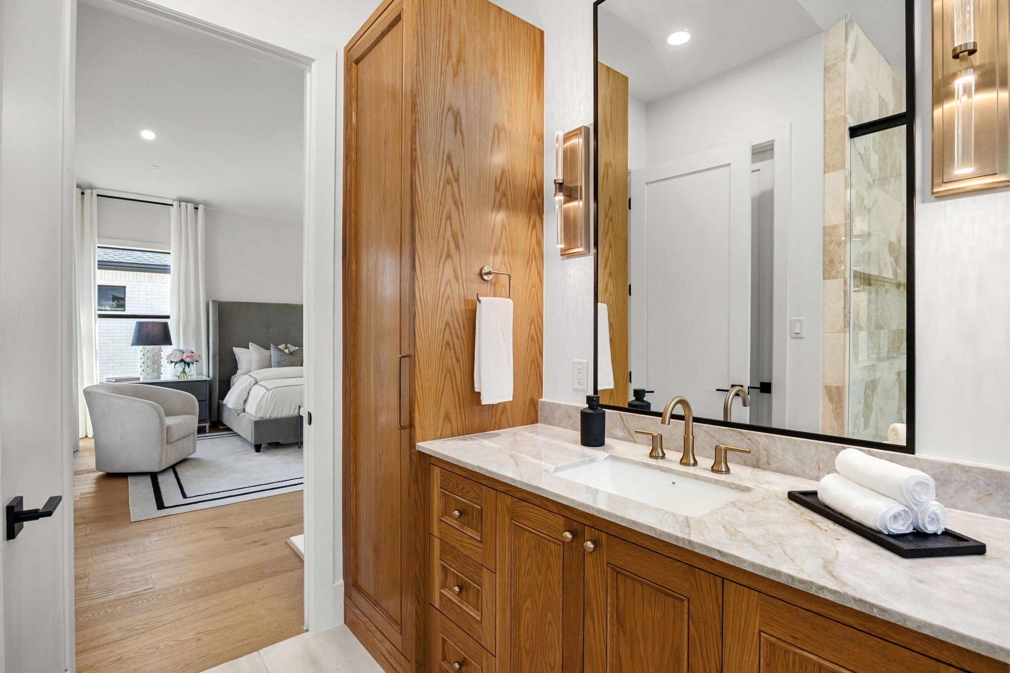 1032 West 41st Street Houston, TX 77018 - Photo 24 of 46 Incredible Primary Bathroom features over-sized walk-in glass encased shower w/ 2 sets of fixtures & soak tub, Custom Site built cabinetry & natural stone wall tile