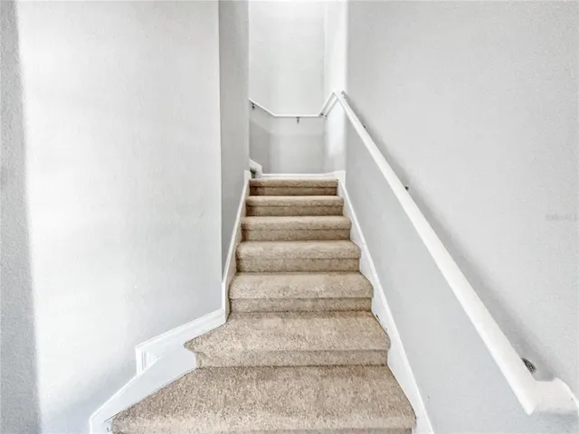 a view of staircase with white walls and white walls
