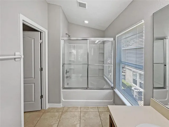 a bathroom with a tub and shower
