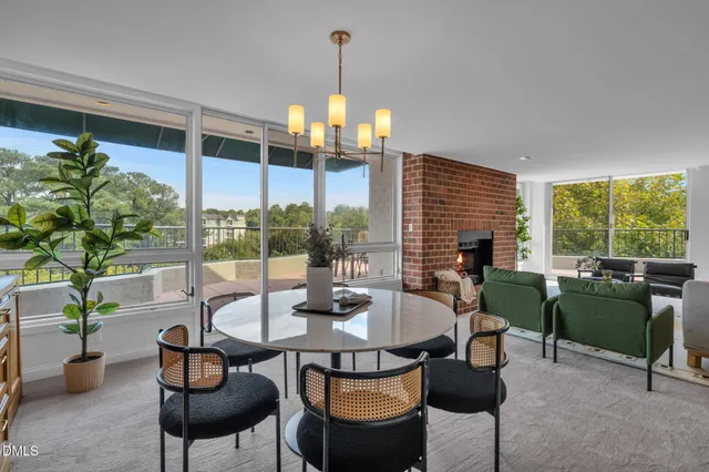 a view of a dining room with furniture window and outside view