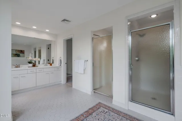 a bedroom with furniture and a large window