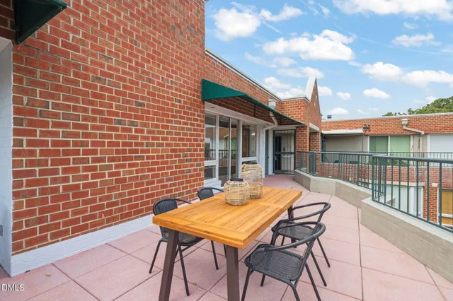 a patio with table and chairs