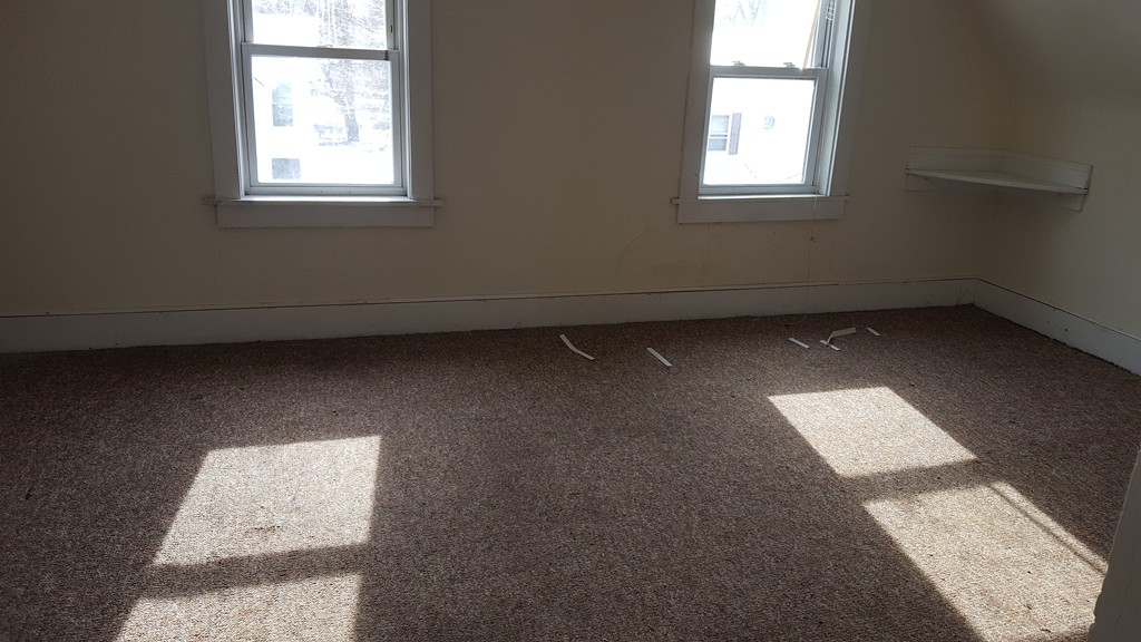 166 Quincy Street Springfield, MA 01109 - Photo 11 of 14 an empty room with a window