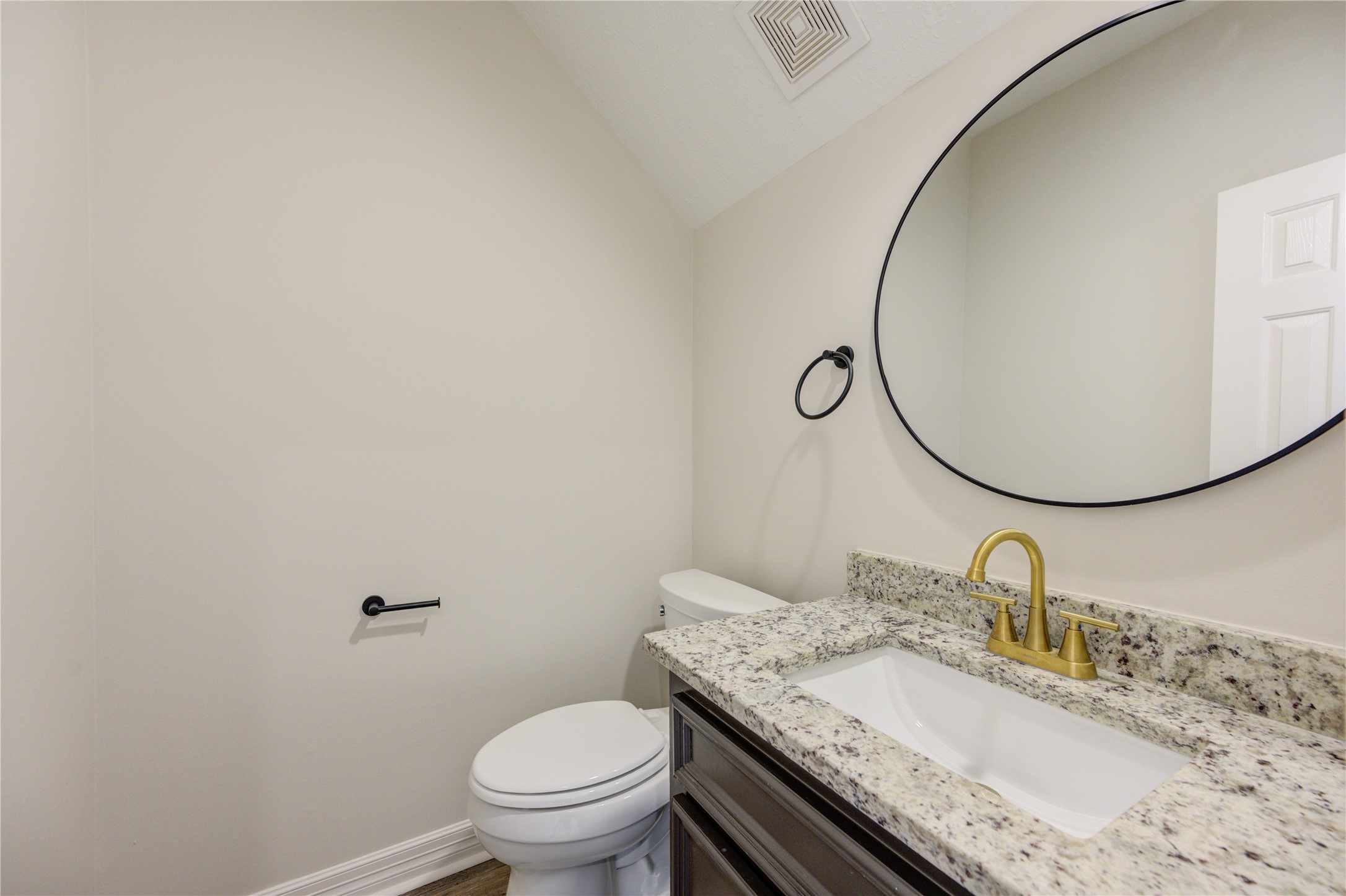 17318 Bonnard Circle Spring, TX 77379 - Photo 23 of 45 The half bath also has a new granite counter, new undermount sink and faucet, and a new mirror.