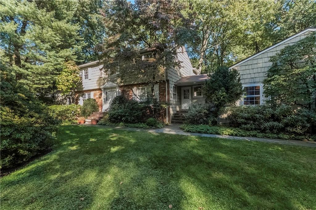 19 Spector Road Woodbridge, CT 06525 - Photo 1 of 1 a front view of a house with a yard