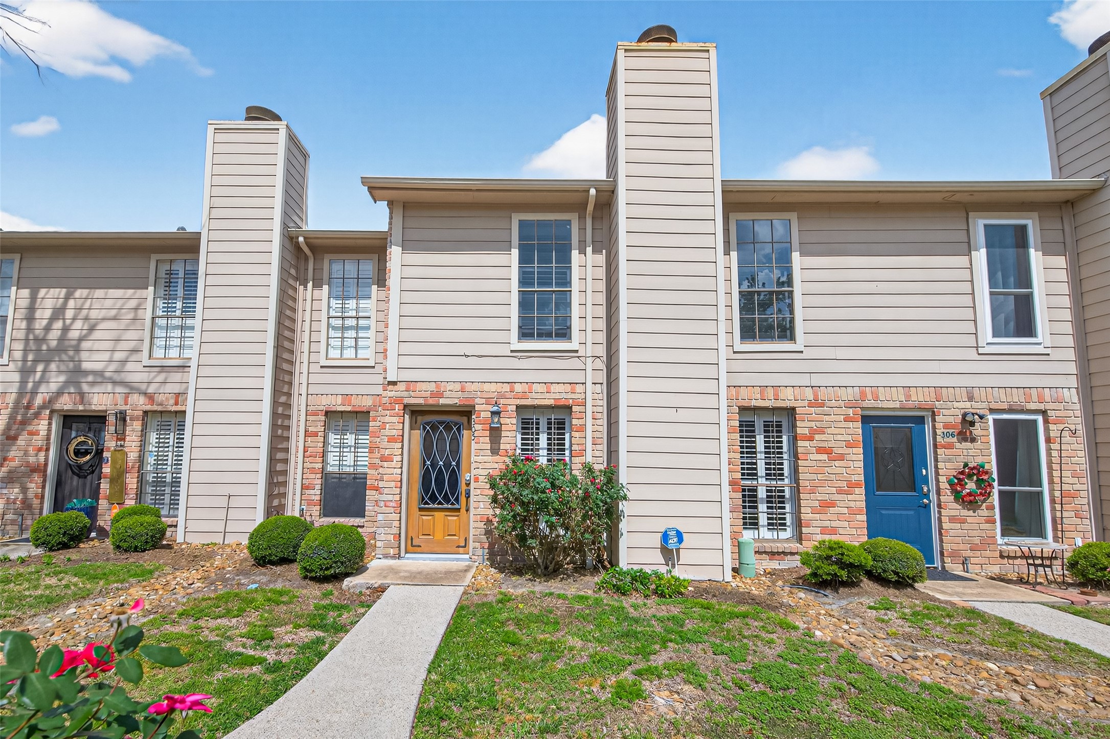 a front view of a house with garden