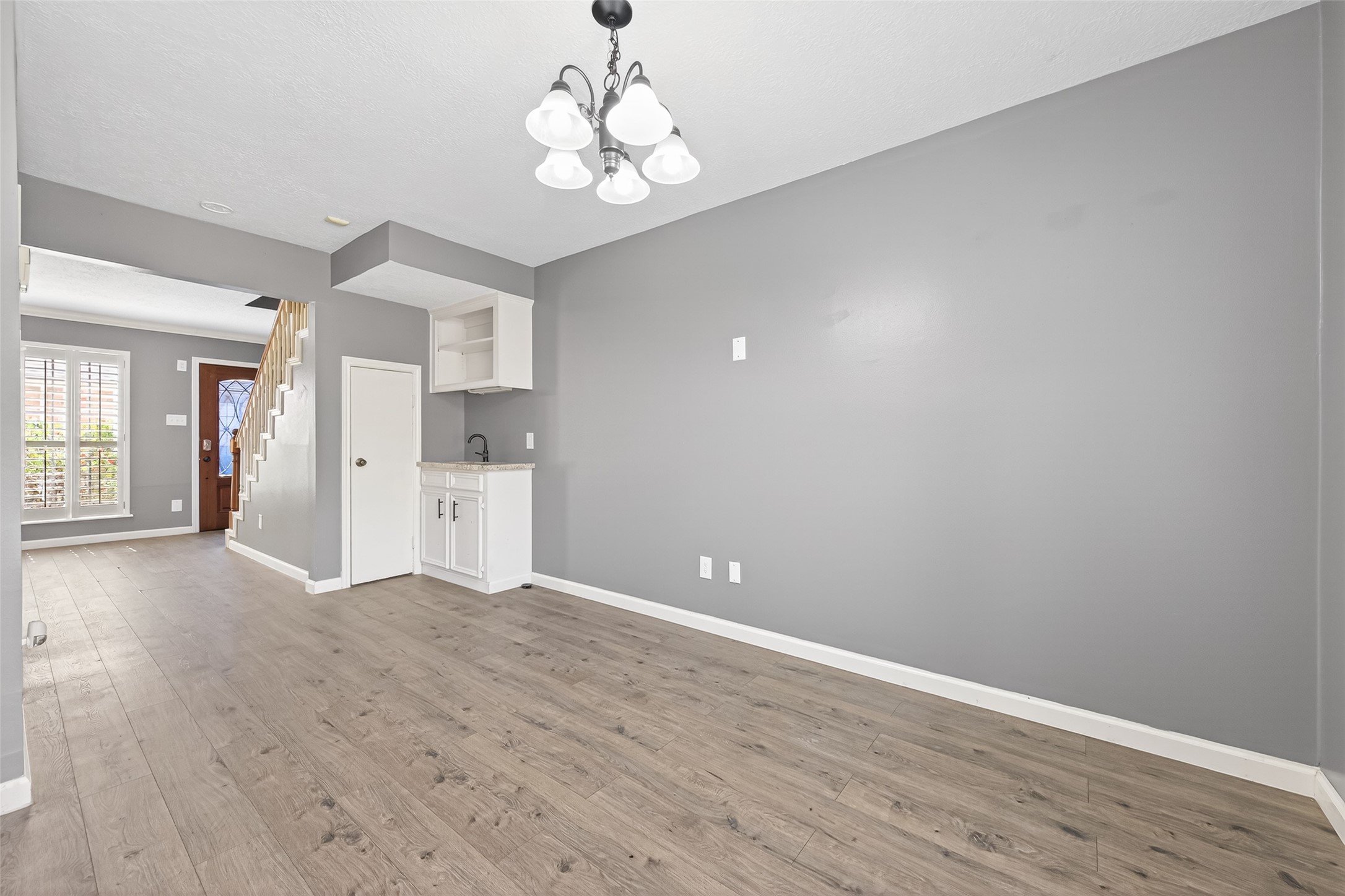 6700 Richardson Road, Unit 305 Houston, TX 77069 - Photo 11 of 46 a view of empty room with wooden floor and window