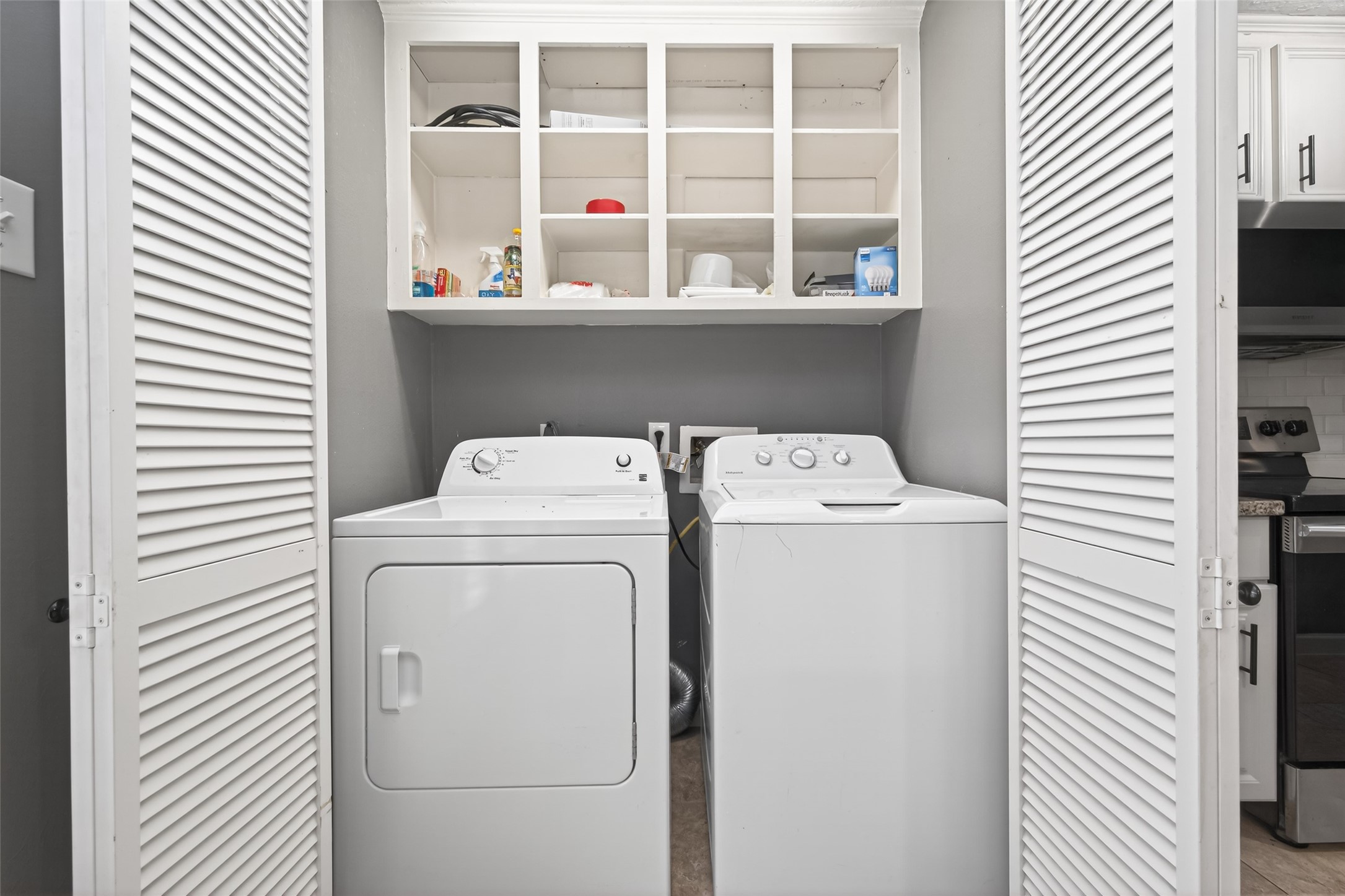 6700 Richardson Road, Unit 305 Houston, TX 77069 - Photo 13 of 46 a utility room with dryer and washer