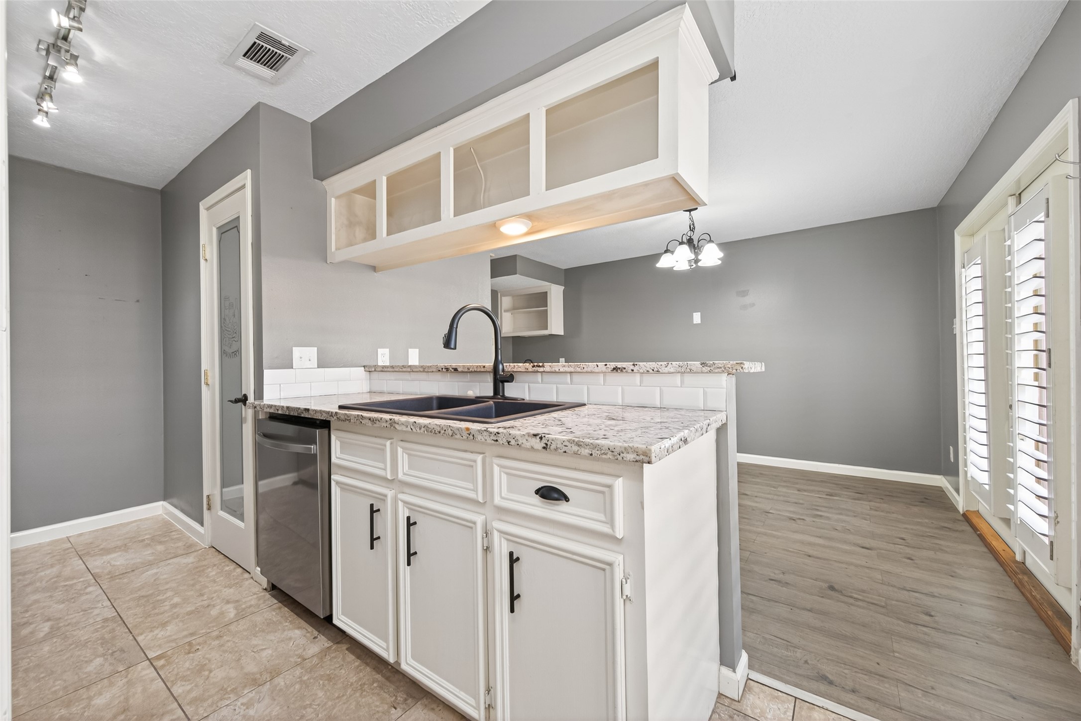 6700 Richardson Road, Unit 305 Houston, TX 77069 - Photo 14 of 46 a kitchen with a sink and cabinets