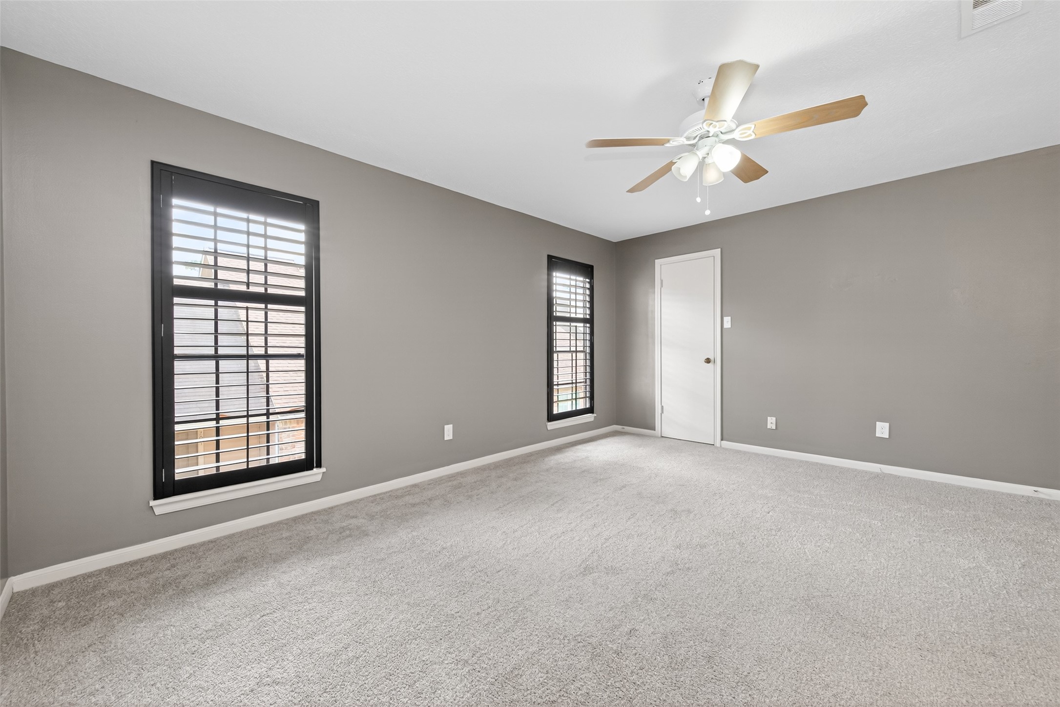 6700 Richardson Road, Unit 305 Houston, TX 77069 - Photo 22 of 46 an empty room with windows and fan