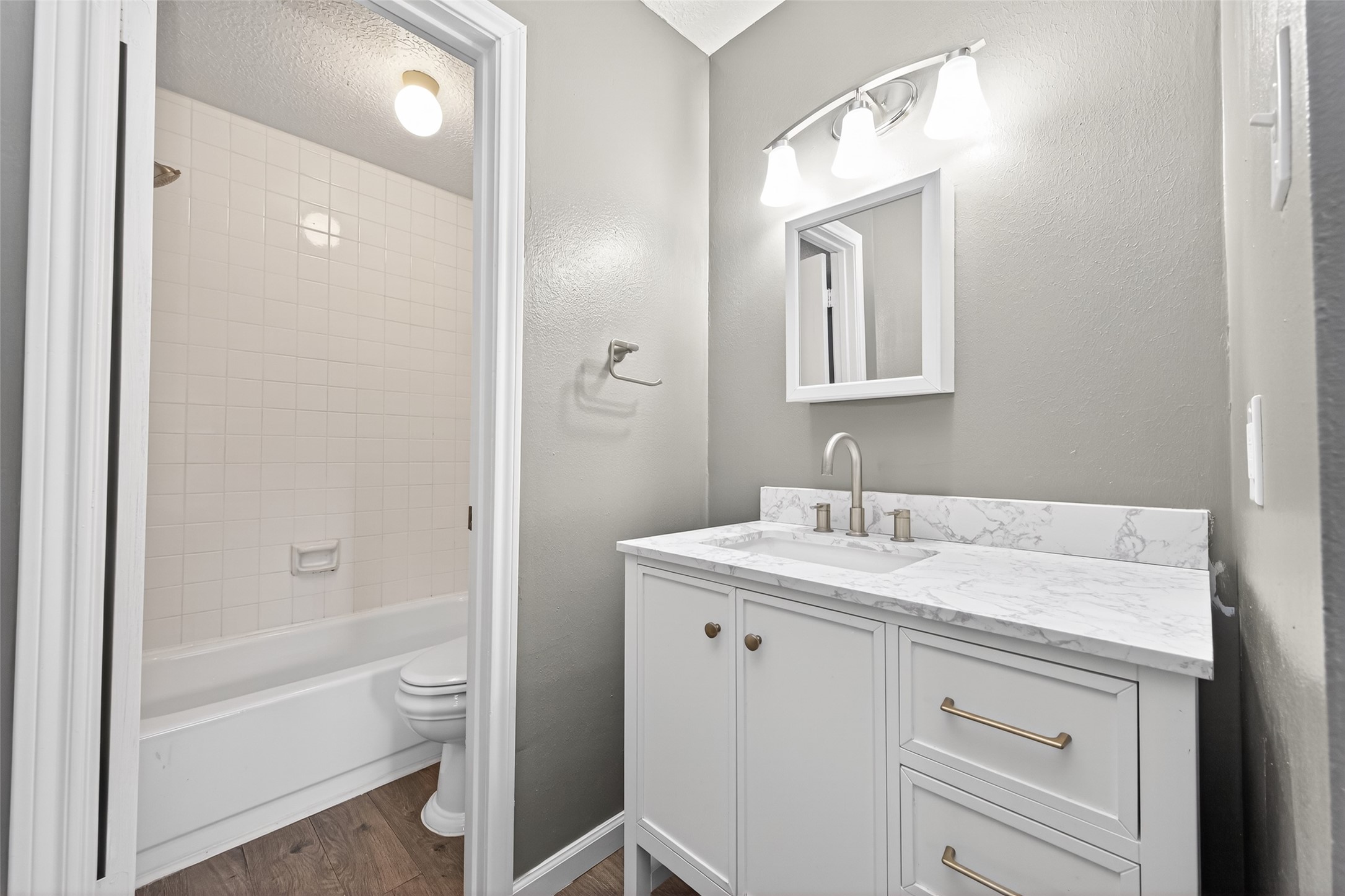 6700 Richardson Road, Unit 305 Houston, TX 77069 - Photo 24 of 46 a bathroom with a sink a toilet and shower