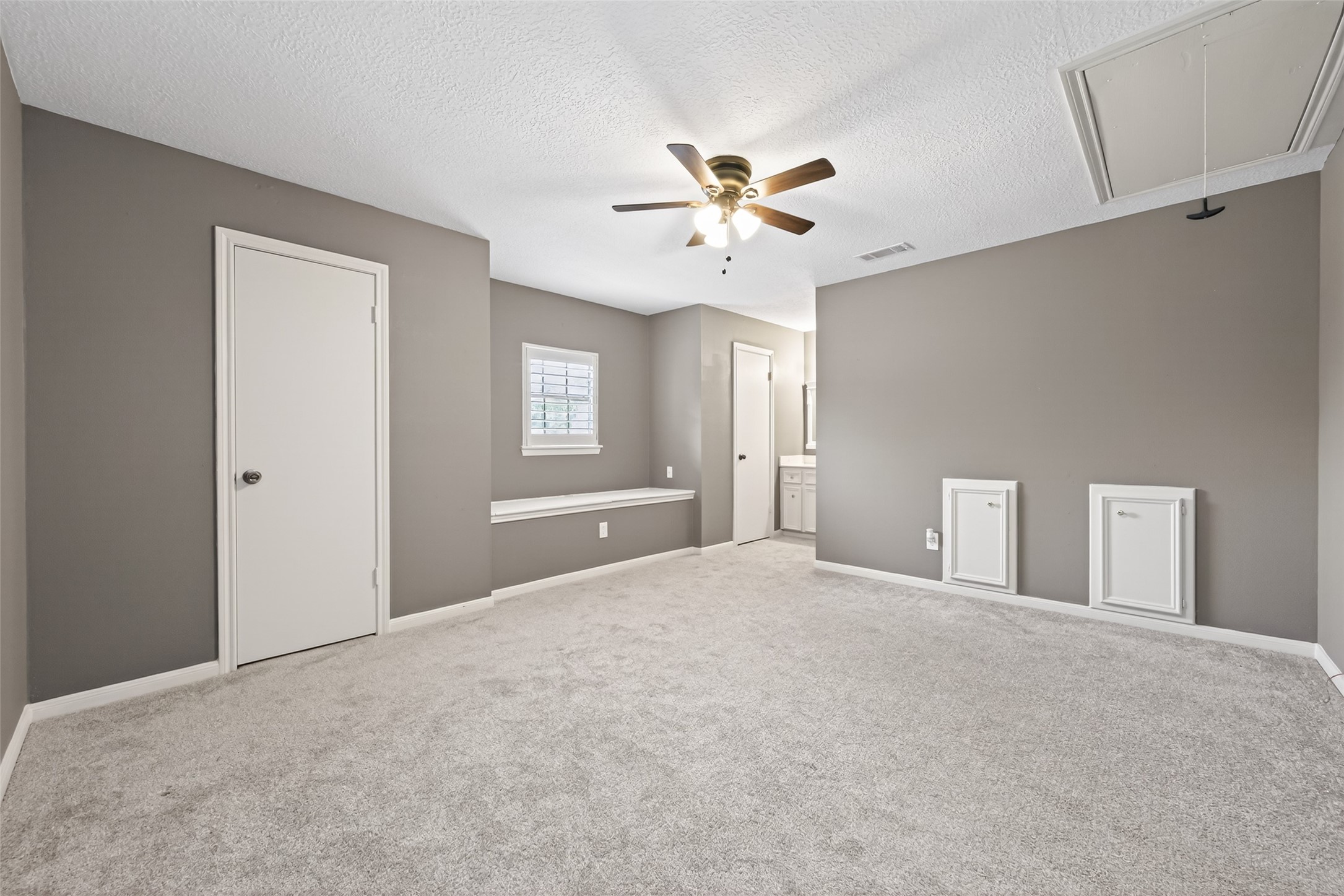 6700 Richardson Road, Unit 305 Houston, TX 77069 - Photo 29 of 46 a view of a big room with chandelier fan and windows