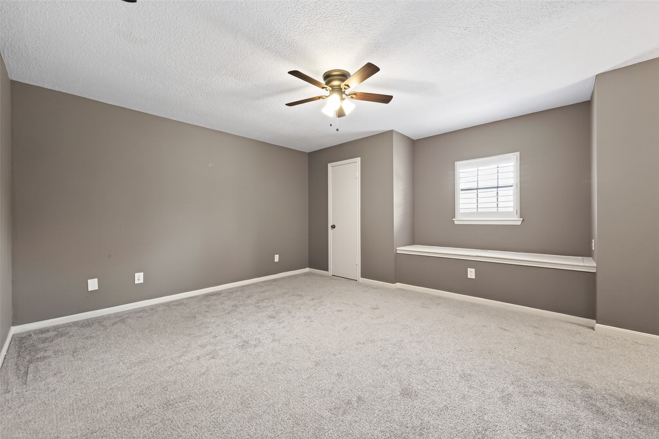 6700 Richardson Road, Unit 305 Houston, TX 77069 - Photo 30 of 46 a view of an empty room with window and chandelier fan