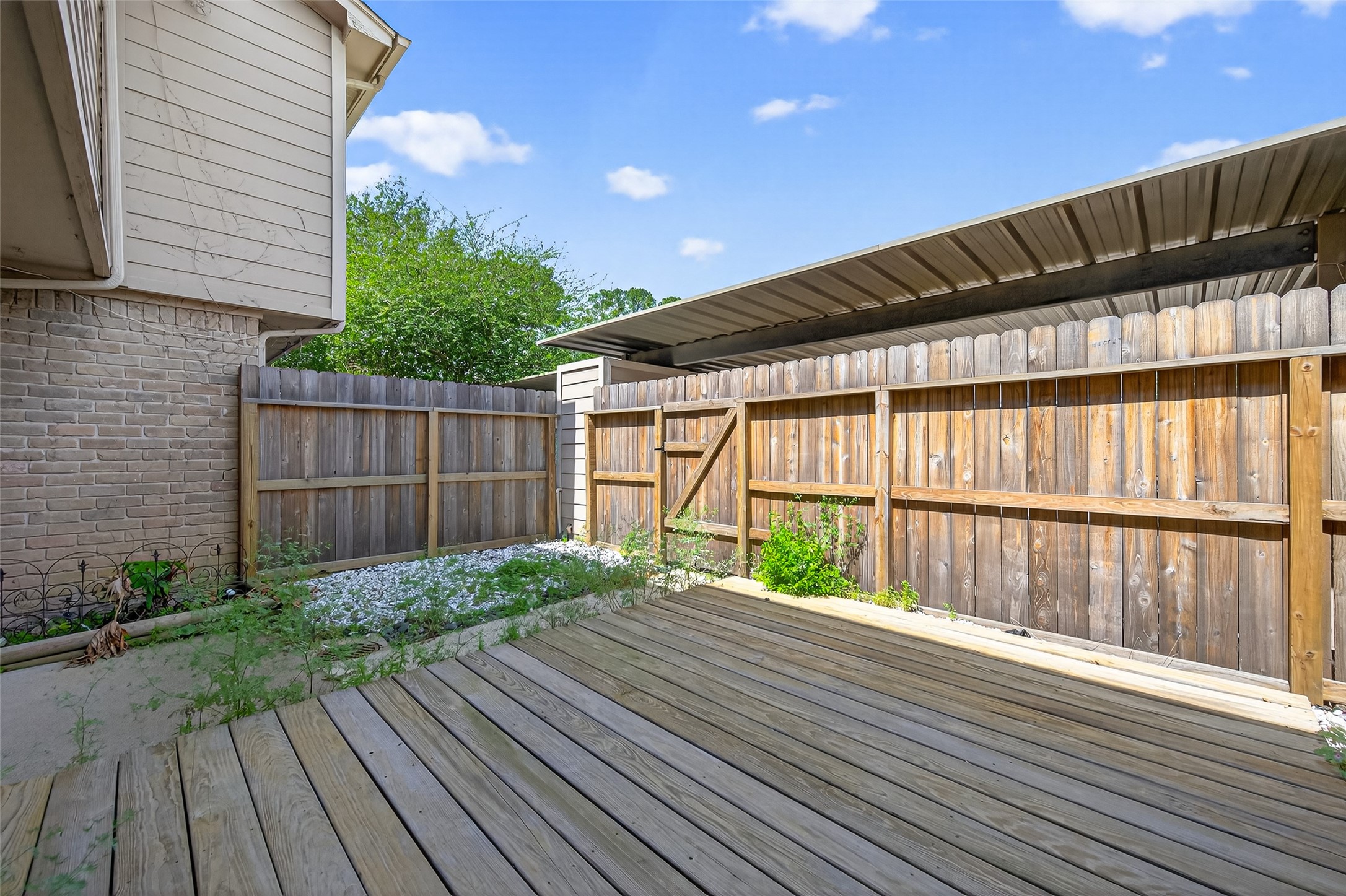 6700 Richardson Road, Unit 305 Houston, TX 77069 - Photo 36 of 46 a view of backyard with small cabin