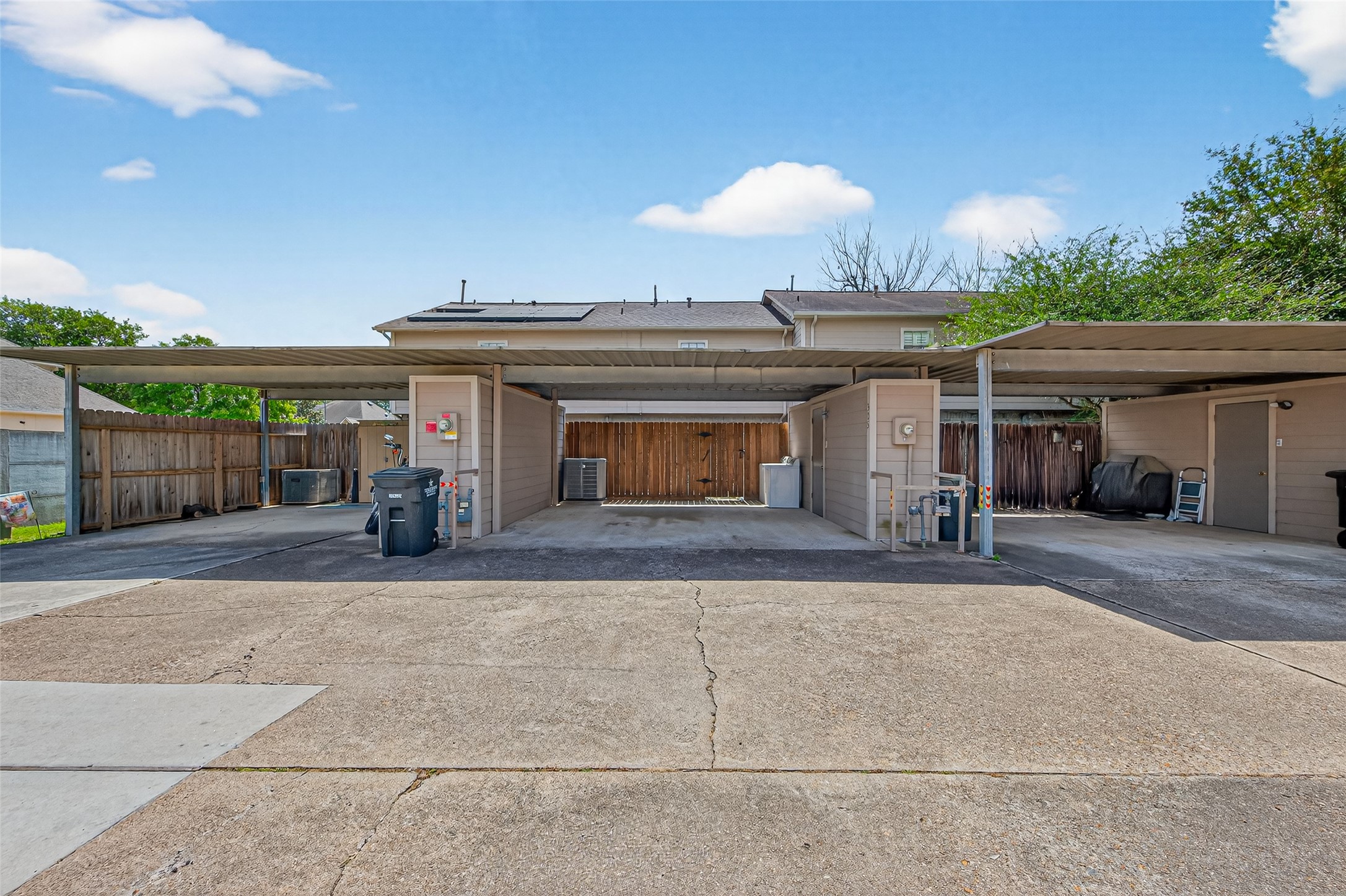6700 Richardson Road, Unit 305 Houston, TX 77069 - Photo 40 of 46 a view of a house with a patio and a yard