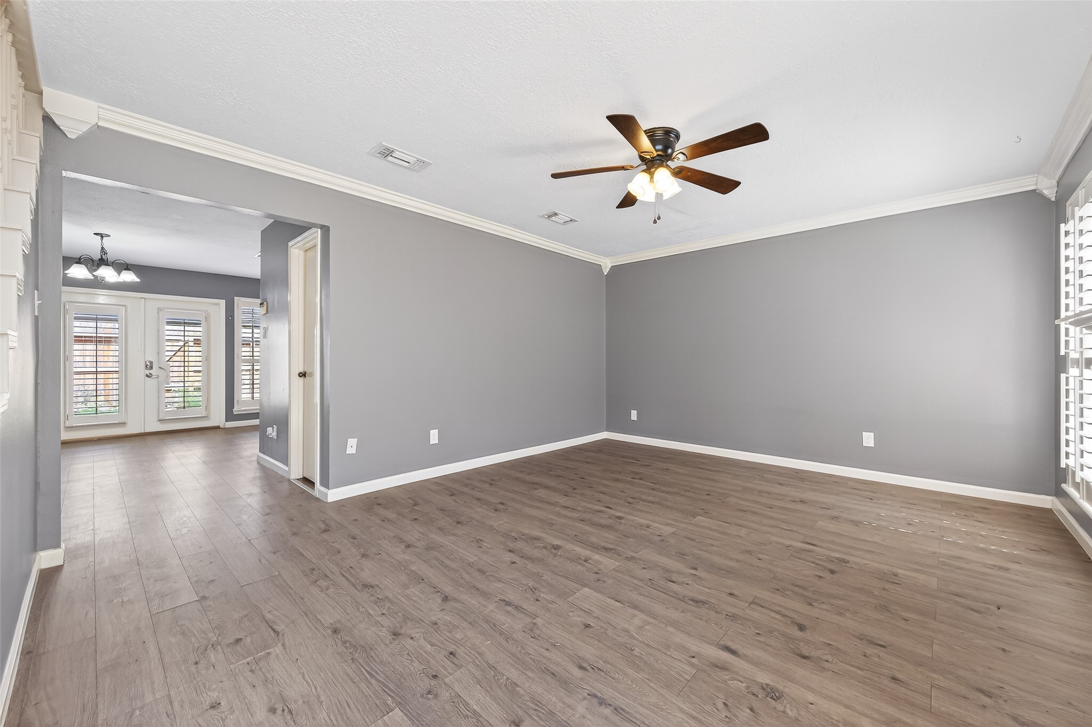 6700 Richardson Road, Unit 305 Houston, TX 77069 - Photo 4 of 46 a view of an empty room with window and wooden floor