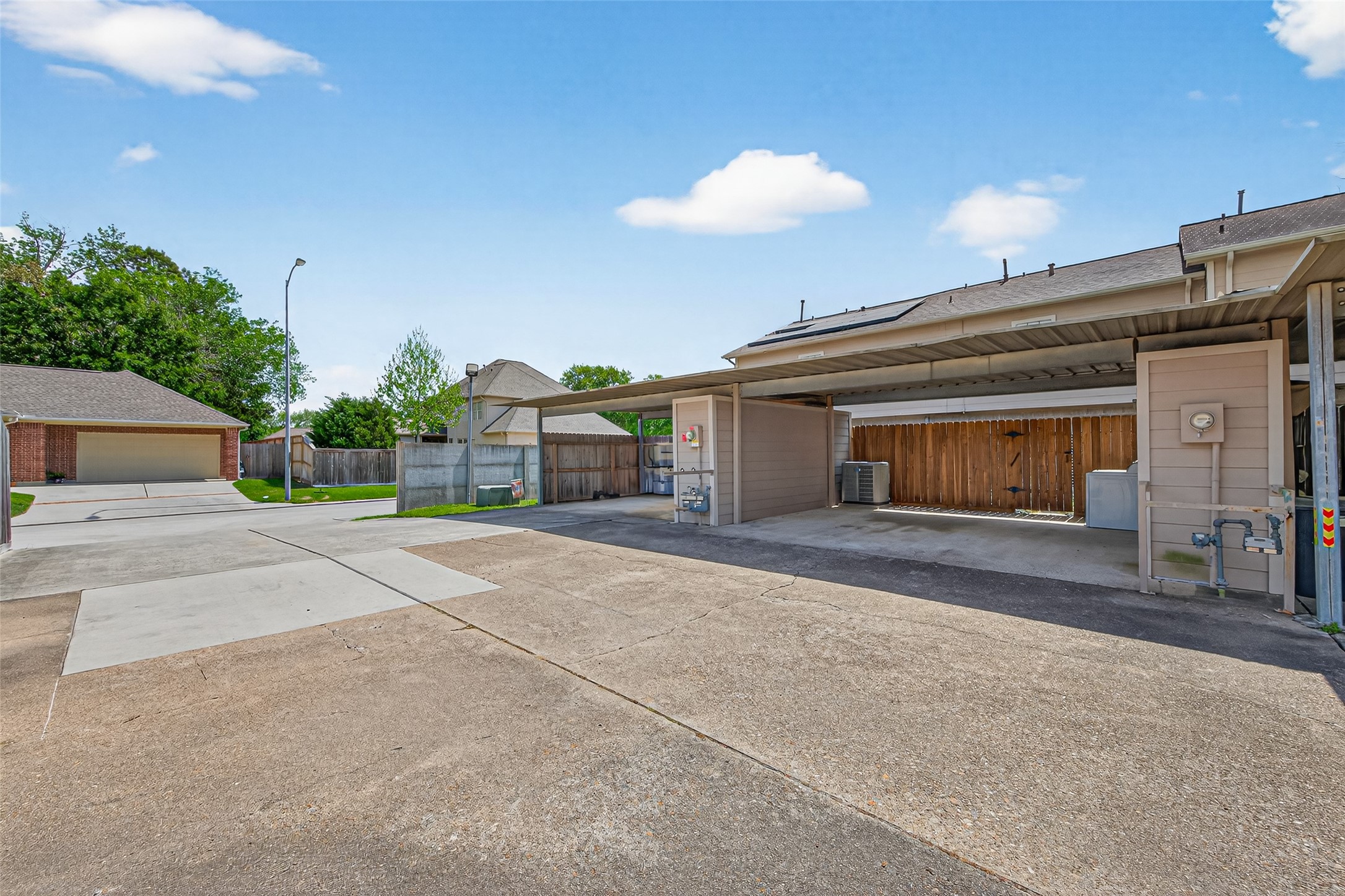 6700 Richardson Road, Unit 305 Houston, TX 77069 - Photo 41 of 46 a view of a house with a yard and garage