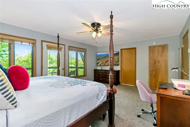 a bedroom with a bed and a table