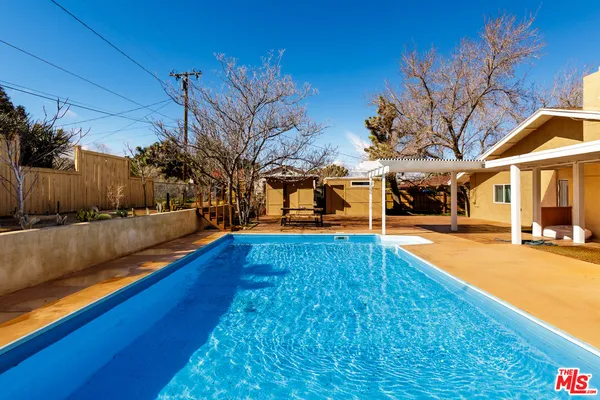 a view of an outdoor space with swimming pool