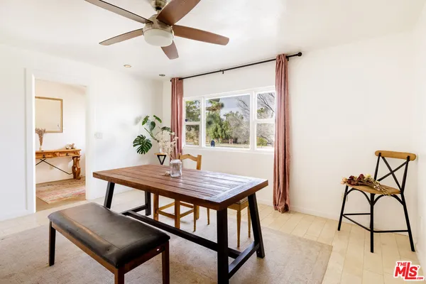 a view of a livingroom with furniture and window