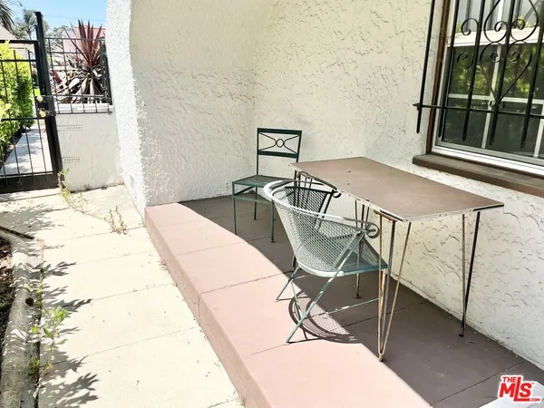a view of a balcony with chairs